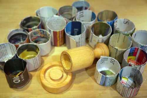 A pile of paper pots, ready for seeds.