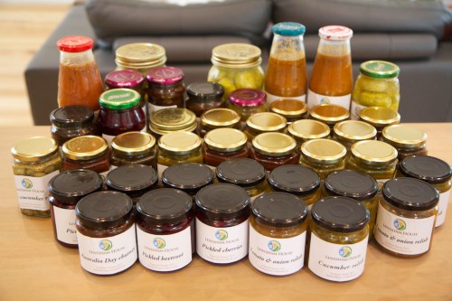 Our summer harvest, converted into jars of pickles and chutneys.