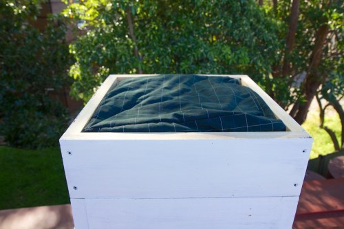 The quilt box in place on the top of the hive.