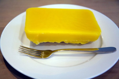 Our first block of beeswax (fork just for scale -- not for eating!)