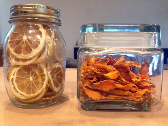 Two jars, of dried lemon and tumeric slices.